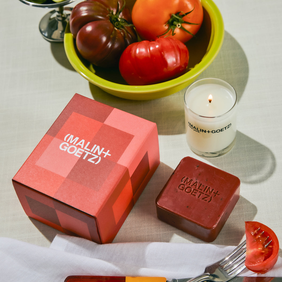 farm to table holiday gift set includes tomato votive. 2.35 oz. / 67g and tomato hand soap. 4 oz. / 113g